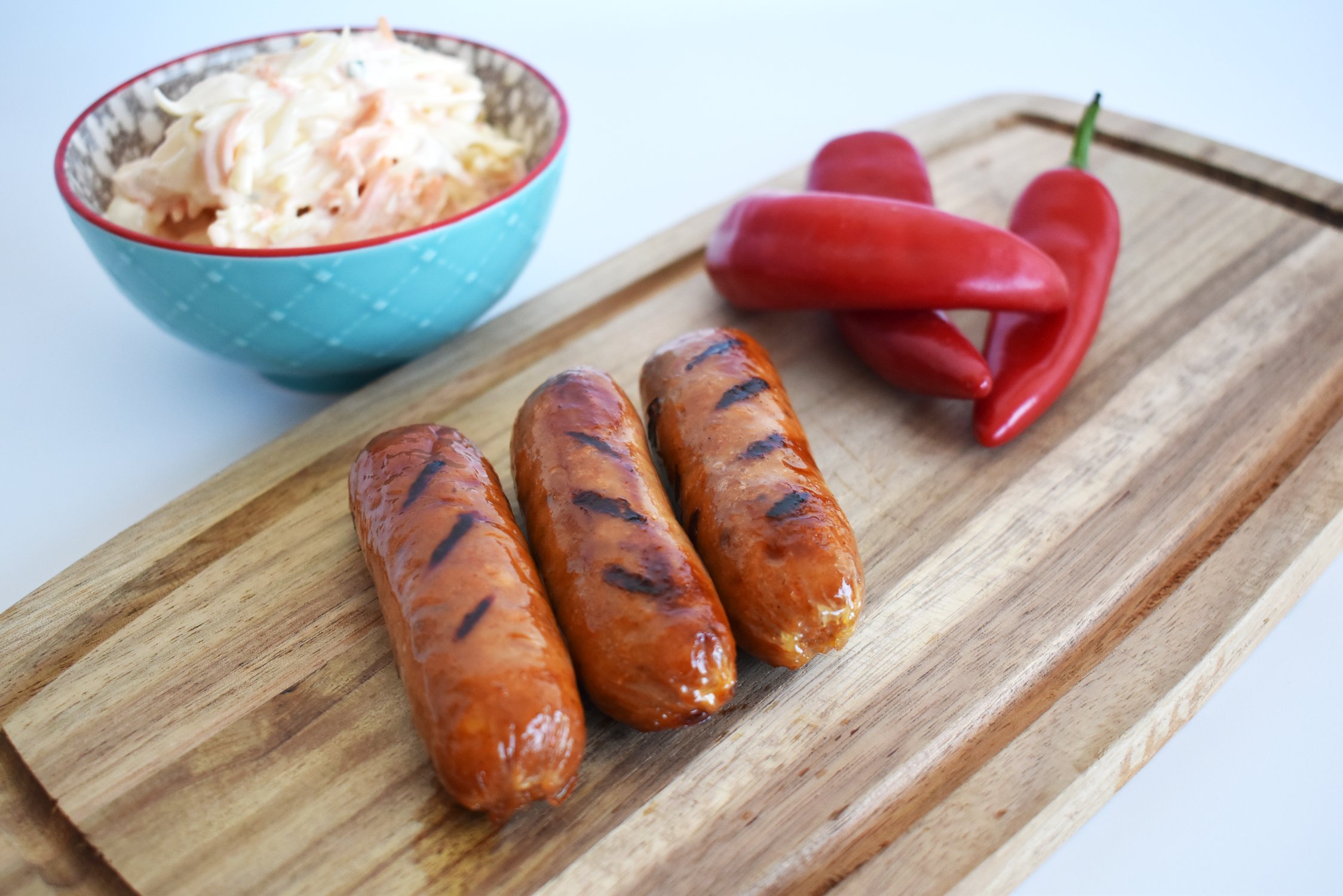 Sausages on chopping board